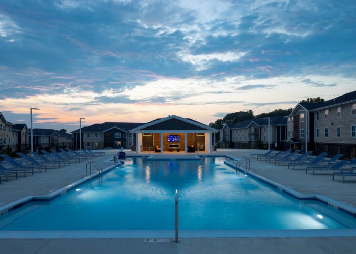 high-end apartment pool at dusk